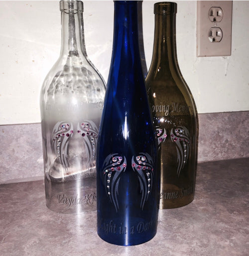 Angel Wings memorial wine bottle candle holders in clear and blue