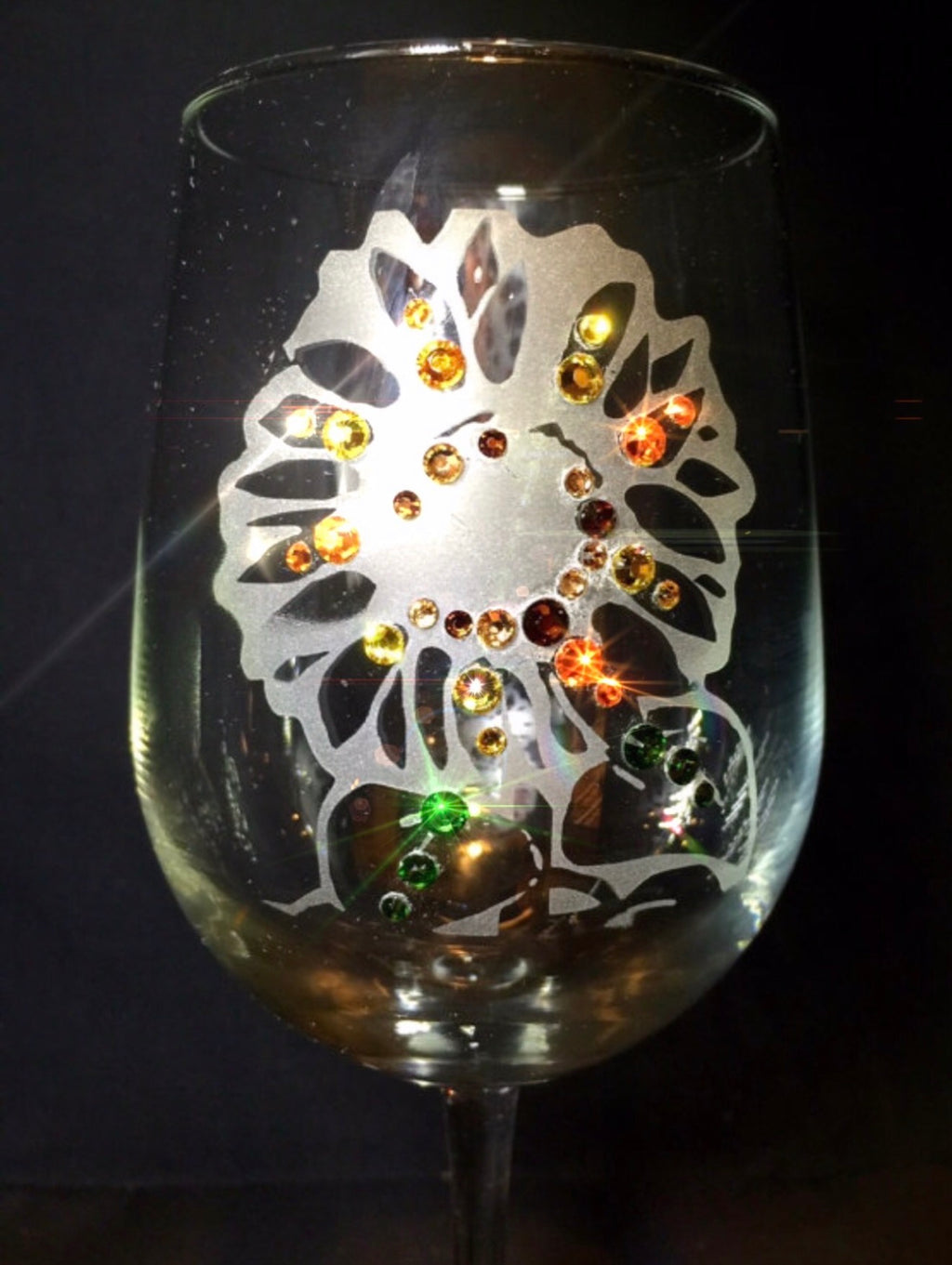 Close-up of Sunflower etched wine glass with Swarovski crystals