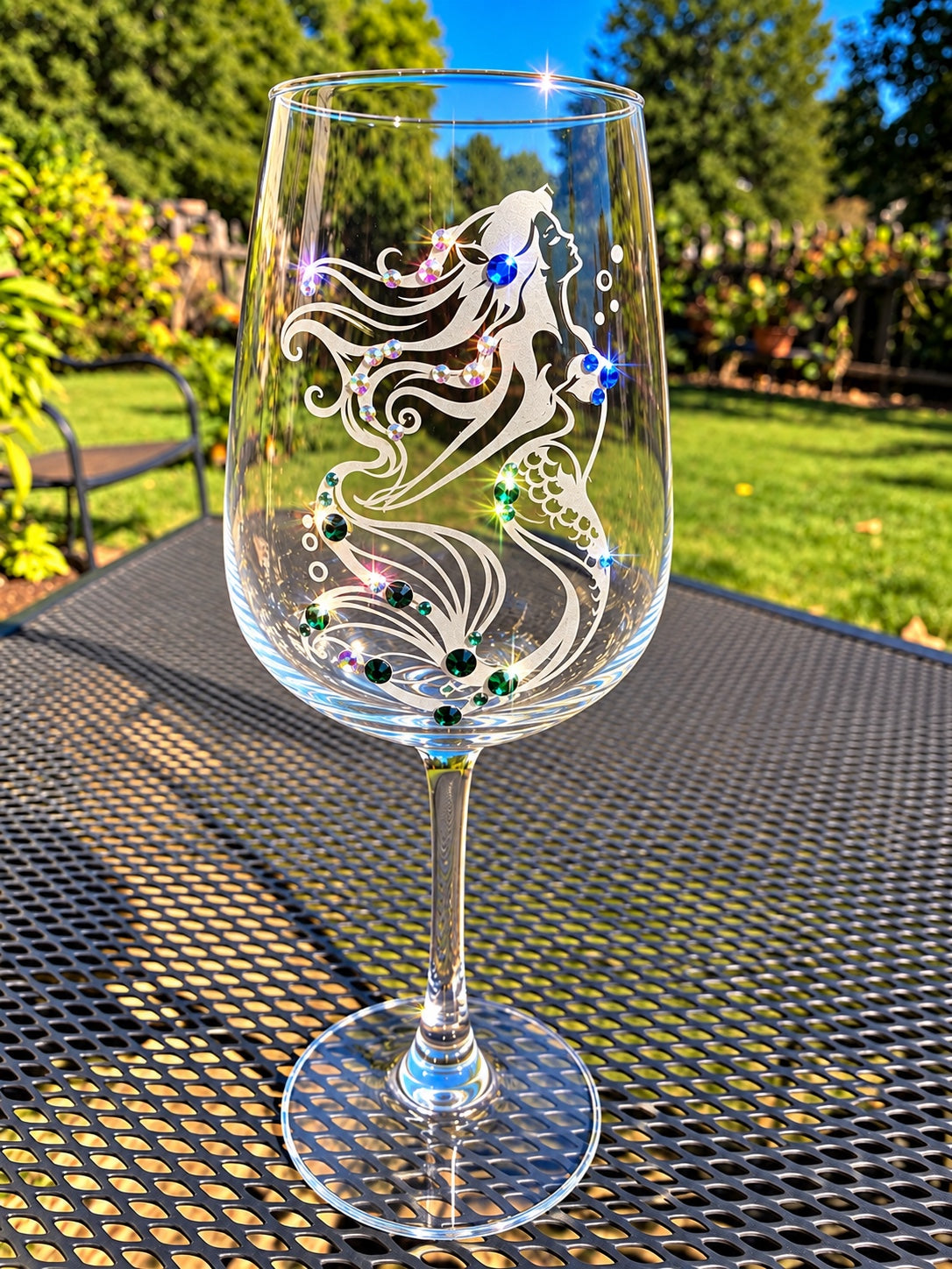 Mermaid 2 hand-etched wine glass with Swarovski crystals outdoors